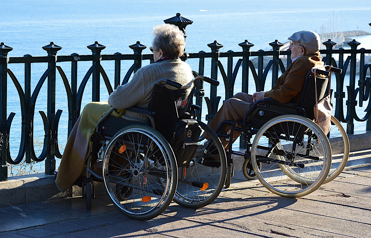elderly couple with wheelchair